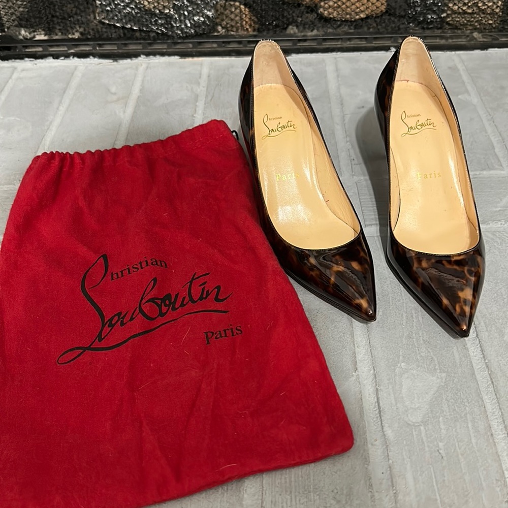 Christian Louboutin pumps in leopard print.